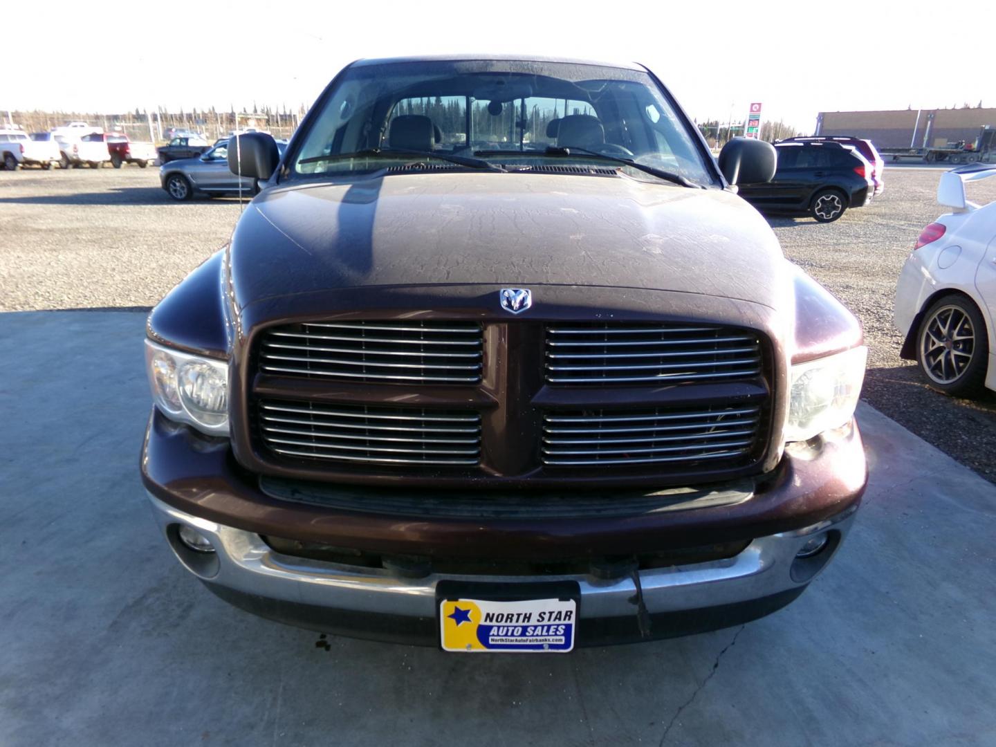 2004 Purple Dodge Ram 1500 Laramie Quad Cab 4WD (1D3HU18D74J) with an 5.7L V8 OHV 16V engine, 5-Speed Automatic Overdrive transmission, located at 2630 Philips Field Rd., Fairbanks, AK, 99709, (907) 458-0593, 64.848068, -147.780609 - Photo#1