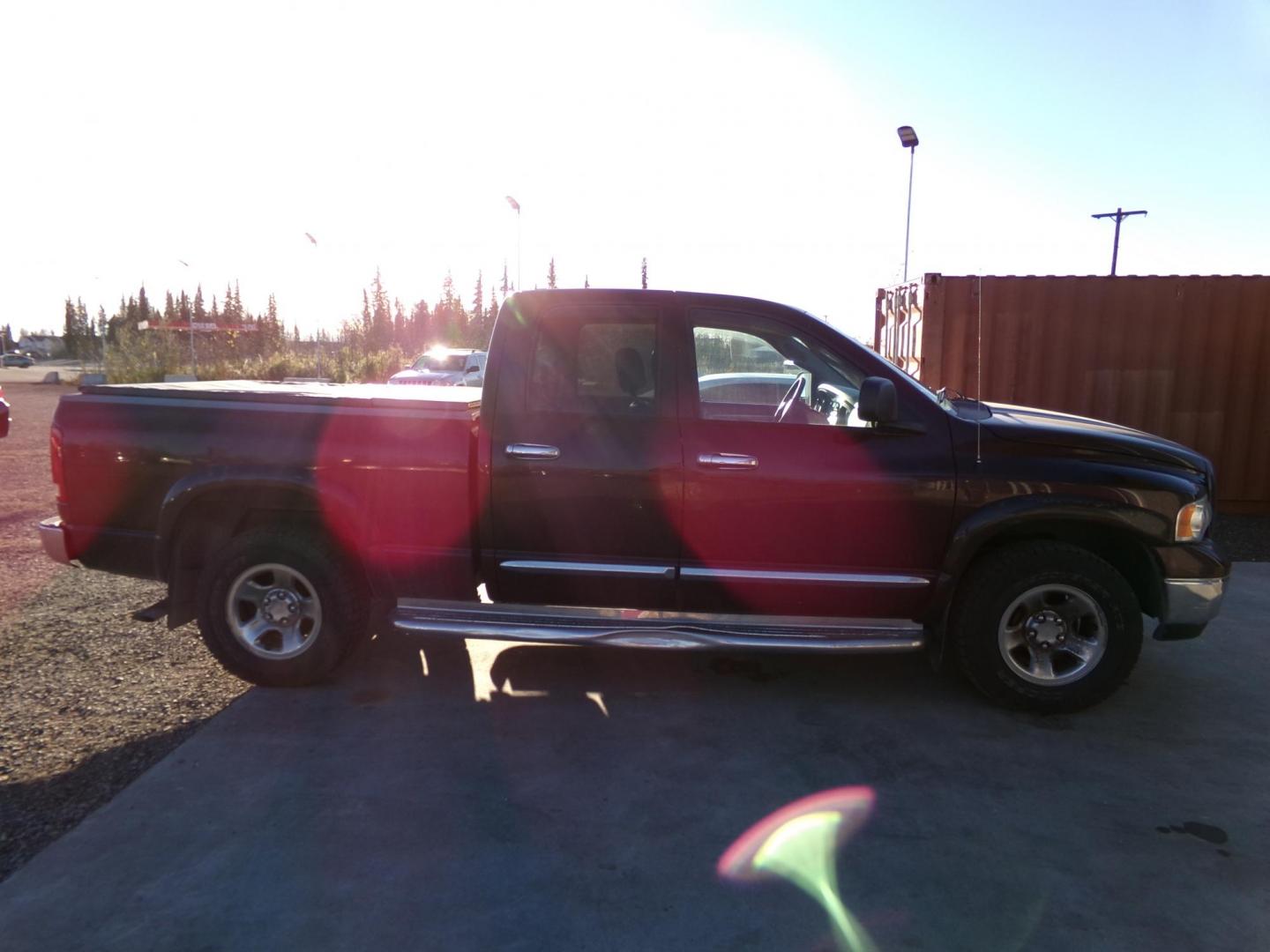 2004 Purple Dodge Ram 1500 Laramie Quad Cab 4WD (1D3HU18D74J) with an 5.7L V8 OHV 16V engine, 5-Speed Automatic Overdrive transmission, located at 2630 Philips Field Rd., Fairbanks, AK, 99709, (907) 458-0593, 64.848068, -147.780609 - Photo#2