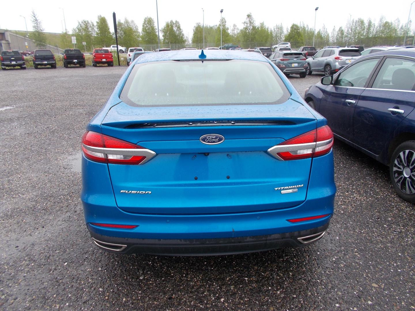 2020 Blue Ford Fusion Titanium AWD (3FA6P0D90LR) with an 2.0L L4 DOHC 16V engine, 6A transmission, located at 2630 Philips Field Rd., Fairbanks, AK, 99709, (907) 458-0593, 64.848068, -147.780609 - Photo#3