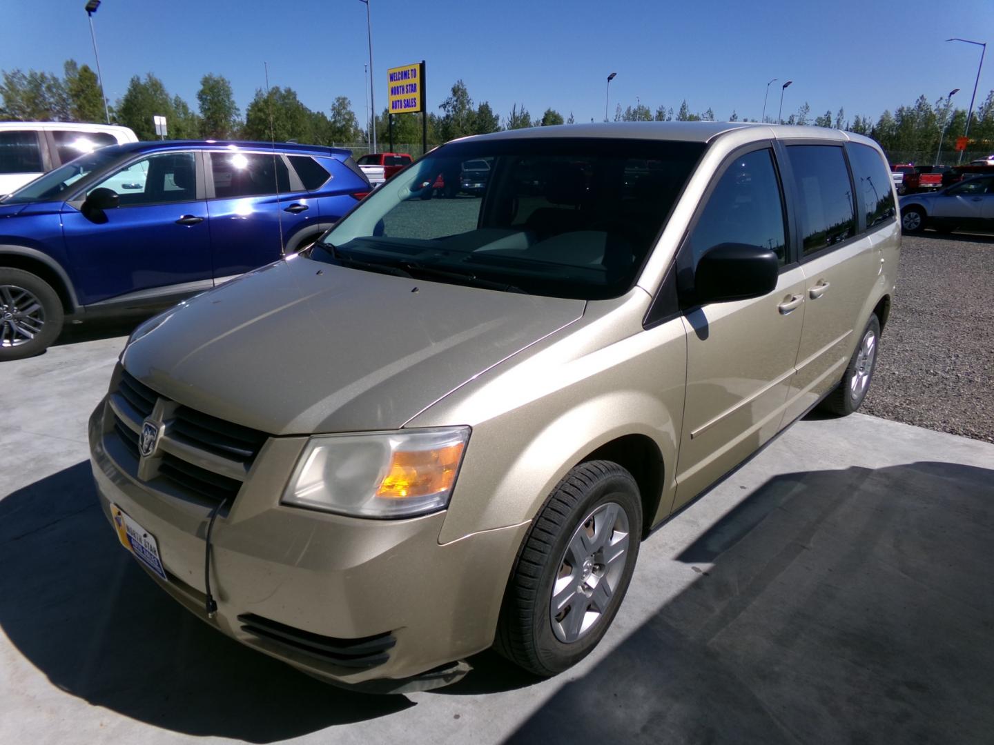 2010 Gold /Black Dodge Grand Caravan SE (2D4RN4DE1AR) with an 3.3L V6 OHV 12V engine, 4-Speed Automatic transmission, located at 2630 Philips Field Rd., Fairbanks, AK, 99709, (907) 458-0593, 64.848068, -147.780609 - Photo#0