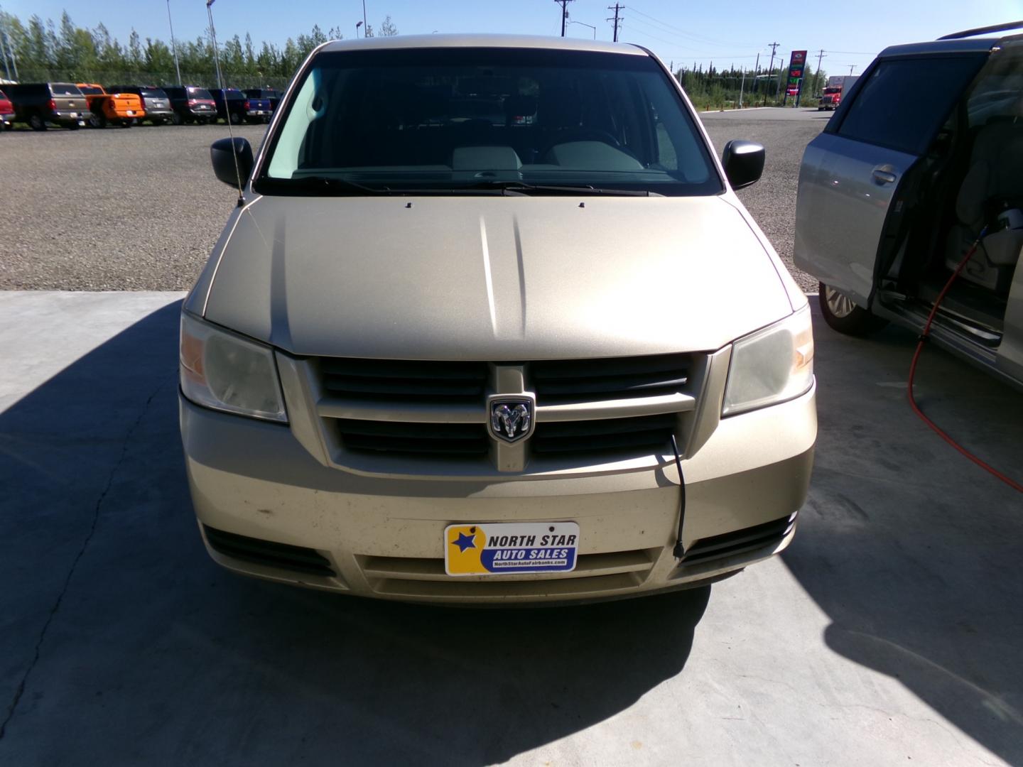 2010 Gold /Black Dodge Grand Caravan SE (2D4RN4DE1AR) with an 3.3L V6 OHV 12V engine, 4-Speed Automatic transmission, located at 2630 Philips Field Rd., Fairbanks, AK, 99709, (907) 458-0593, 64.848068, -147.780609 - Photo#1