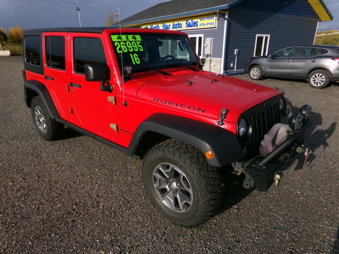 2016 Red /Black Jeep Wrangler Unlimited Rubicon 4WD (1C4BJWFG6GL) with an 3.6L V6 DOHC 24V FFV engine, 6-Speed Manual transmission, located at 2630 Philips Field Rd., Fairbanks, AK, 99709, (907) 458-0593, 64.848068, -147.780609 - Photo#0