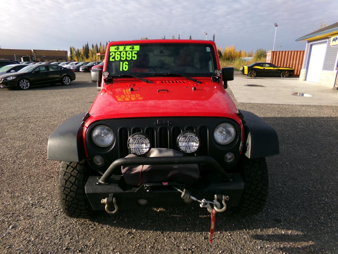 2016 Red /Black Jeep Wrangler Unlimited Rubicon 4WD (1C4BJWFG6GL) with an 3.6L V6 DOHC 24V FFV engine, 6-Speed Manual transmission, located at 2630 Philips Field Rd., Fairbanks, AK, 99709, (907) 458-0593, 64.848068, -147.780609 - Photo#1