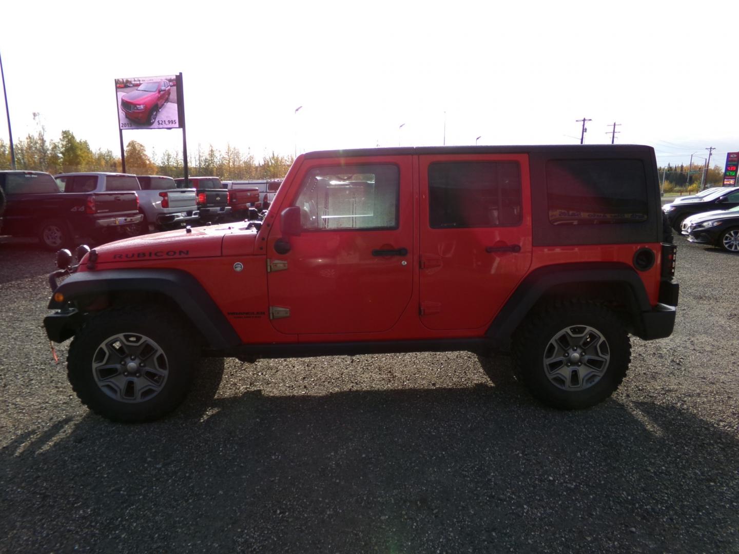 2016 Red /Black Jeep Wrangler Unlimited Rubicon 4WD (1C4BJWFG6GL) with an 3.6L V6 DOHC 24V FFV engine, 6-Speed Manual transmission, located at 2630 Philips Field Rd., Fairbanks, AK, 99709, (907) 458-0593, 64.848068, -147.780609 - Photo#2