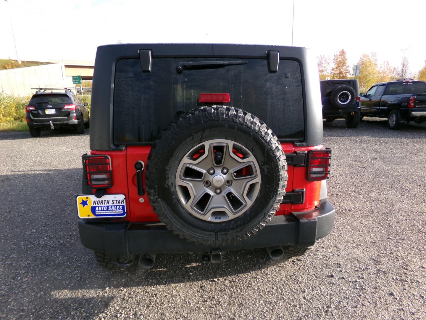 2016 Red /Black Jeep Wrangler Unlimited Rubicon 4WD (1C4BJWFG6GL) with an 3.6L V6 DOHC 24V FFV engine, 6-Speed Manual transmission, located at 2630 Philips Field Rd., Fairbanks, AK, 99709, (907) 458-0593, 64.848068, -147.780609 - Photo#3