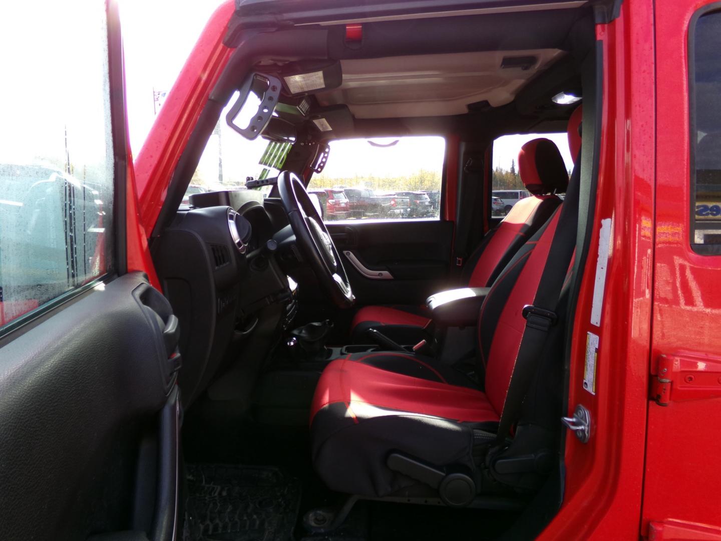 2016 Red /Black Jeep Wrangler Unlimited Rubicon 4WD (1C4BJWFG6GL) with an 3.6L V6 DOHC 24V FFV engine, 6-Speed Manual transmission, located at 2630 Philips Field Rd., Fairbanks, AK, 99709, (907) 458-0593, 64.848068, -147.780609 - Photo#4