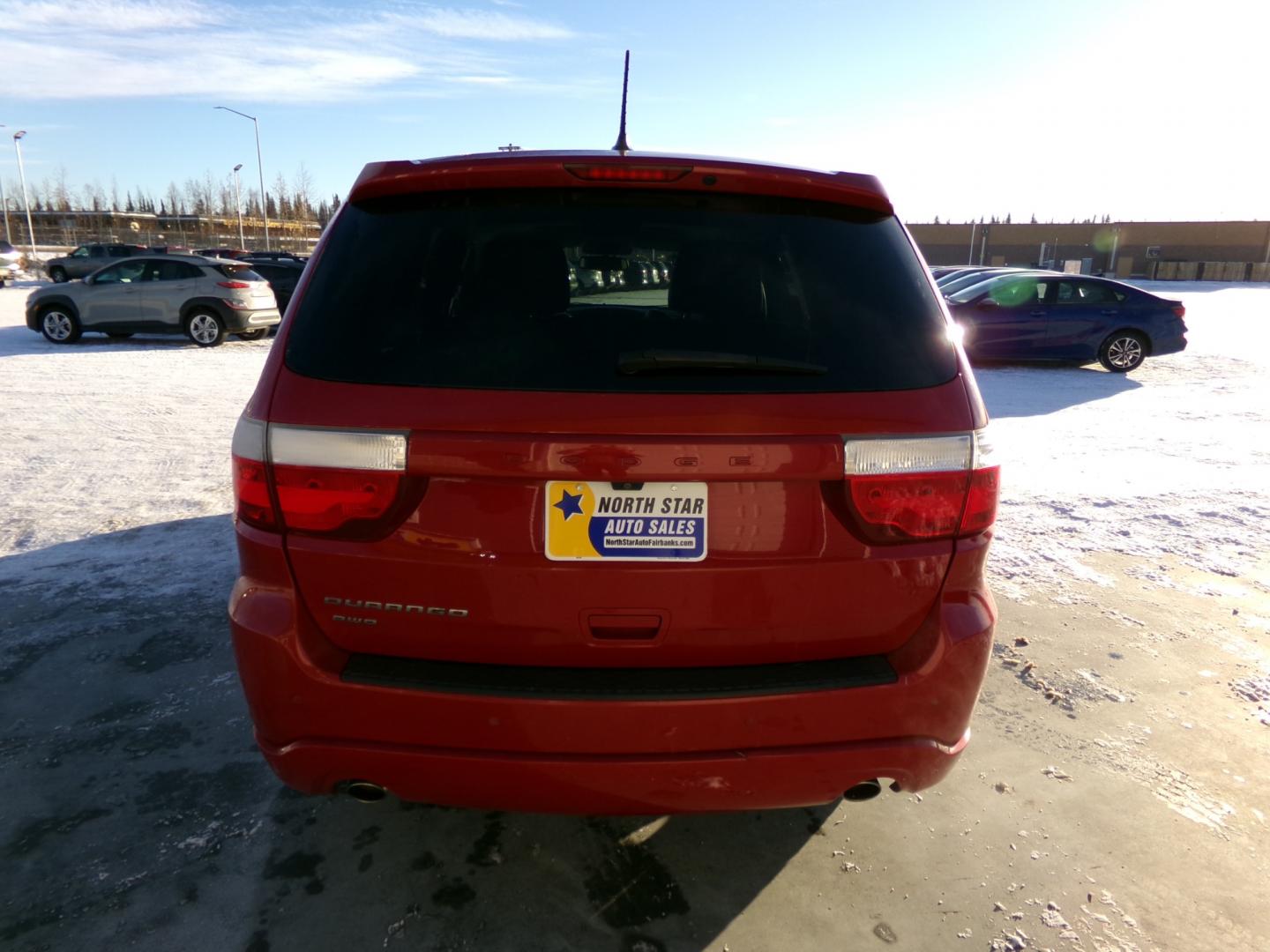 2013 Red Dodge Durango SXT AWD (1C4RDJAG4DC) with an 3.6L V6 DOHC 24V engine, 5-Speed Automatic transmission, located at 2630 Philips Field Rd., Fairbanks, AK, 99709, (907) 458-0593, 64.848068, -147.780609 - Photo#3