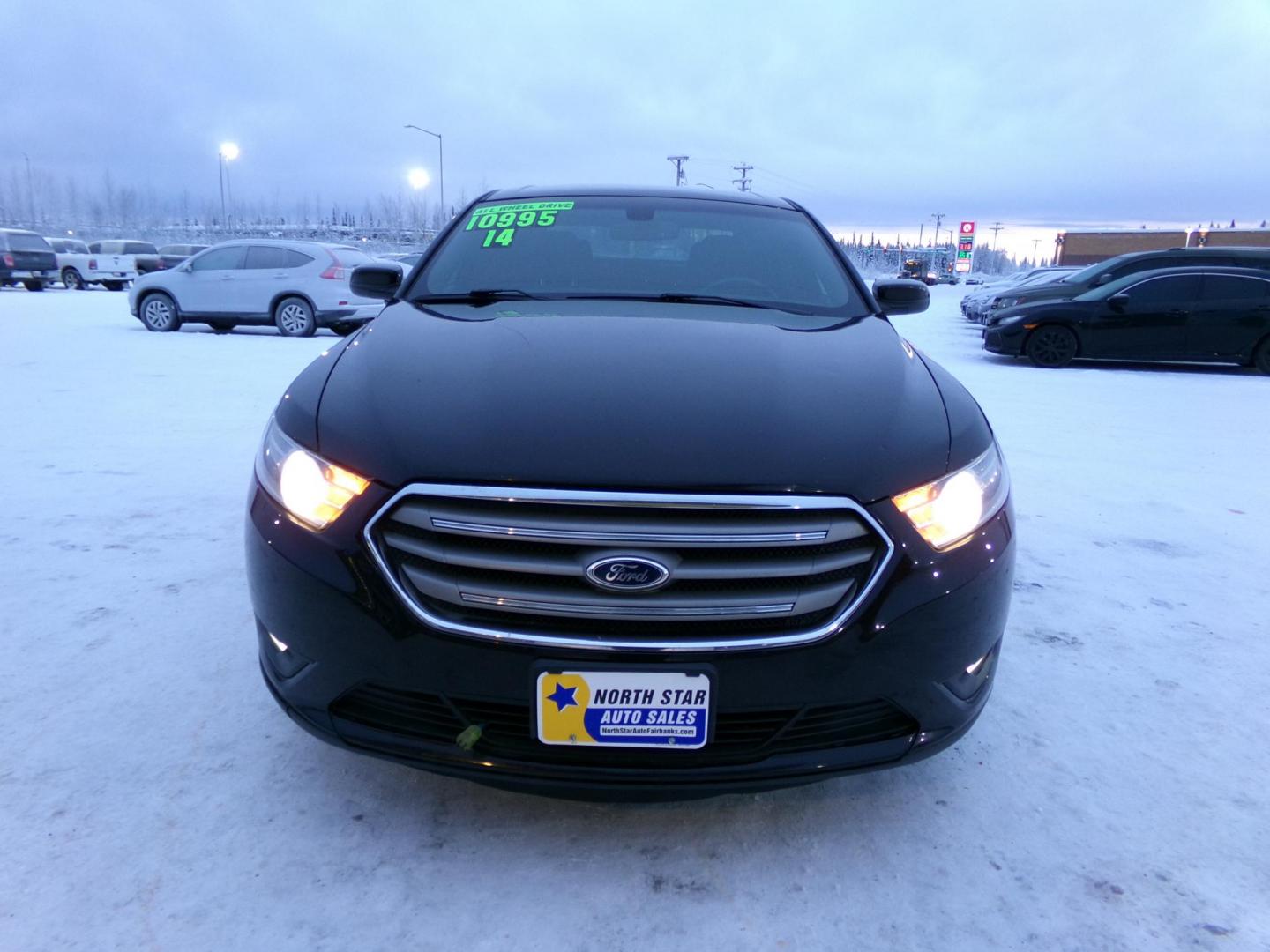 2014 Brown /Black Ford Taurus SEL (1FAHP2H85EG) with an 3.5L V6 DOHC 24V engine, 6-Speed Automatic transmission, located at 2630 Philips Field Rd., Fairbanks, AK, 99709, (907) 458-0593, 64.848068, -147.780609 - Photo#1