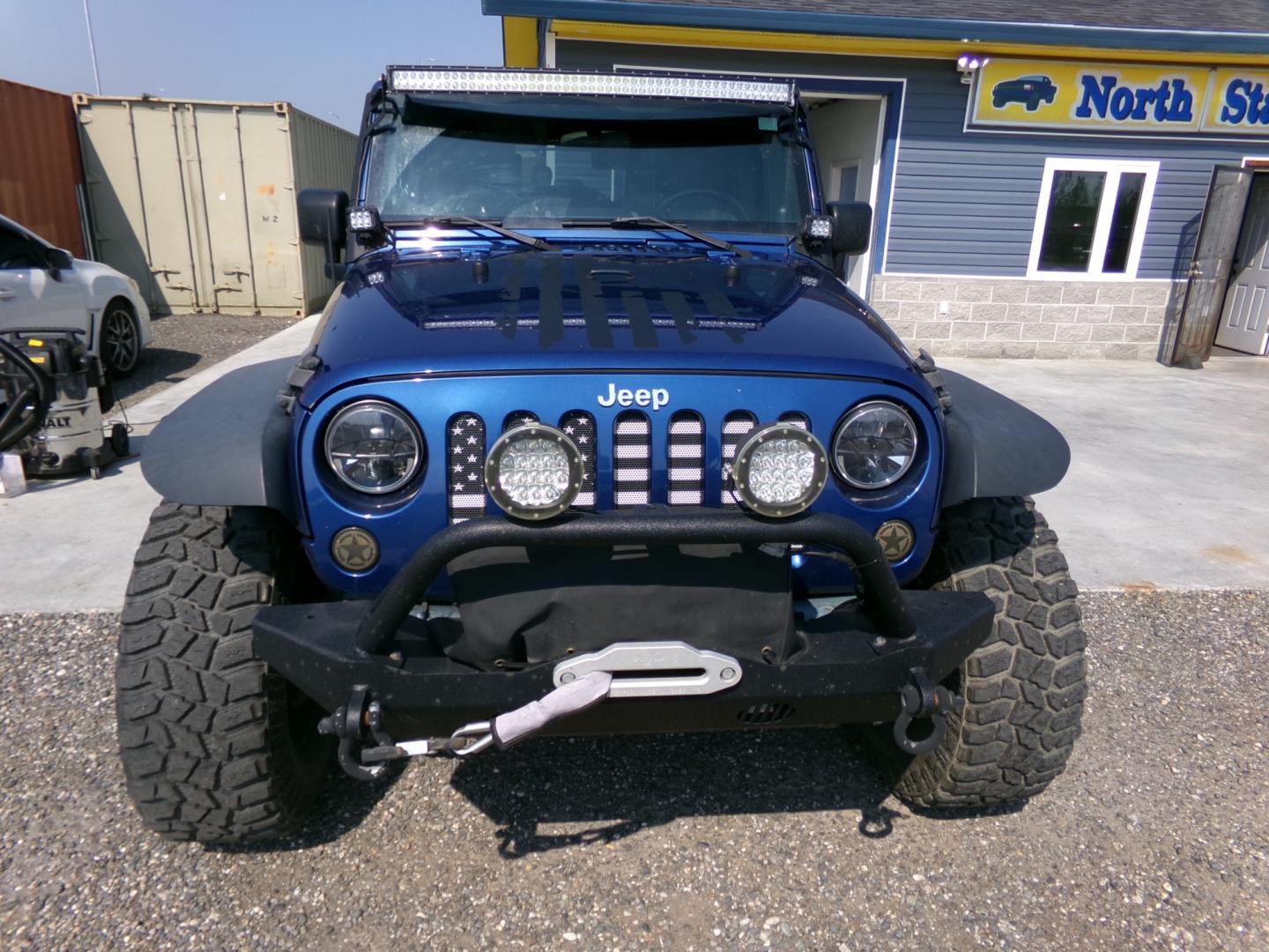 2010 Blue Jeep Wrangler Unlimited Rubicon 4WD (1J4BA6H1XAL) with an 3.8L V6 OHV 12V engine, located at 2630 Philips Field Rd., Fairbanks, AK, 99709, (907) 458-0593, 64.848068, -147.780609 - Photo#1