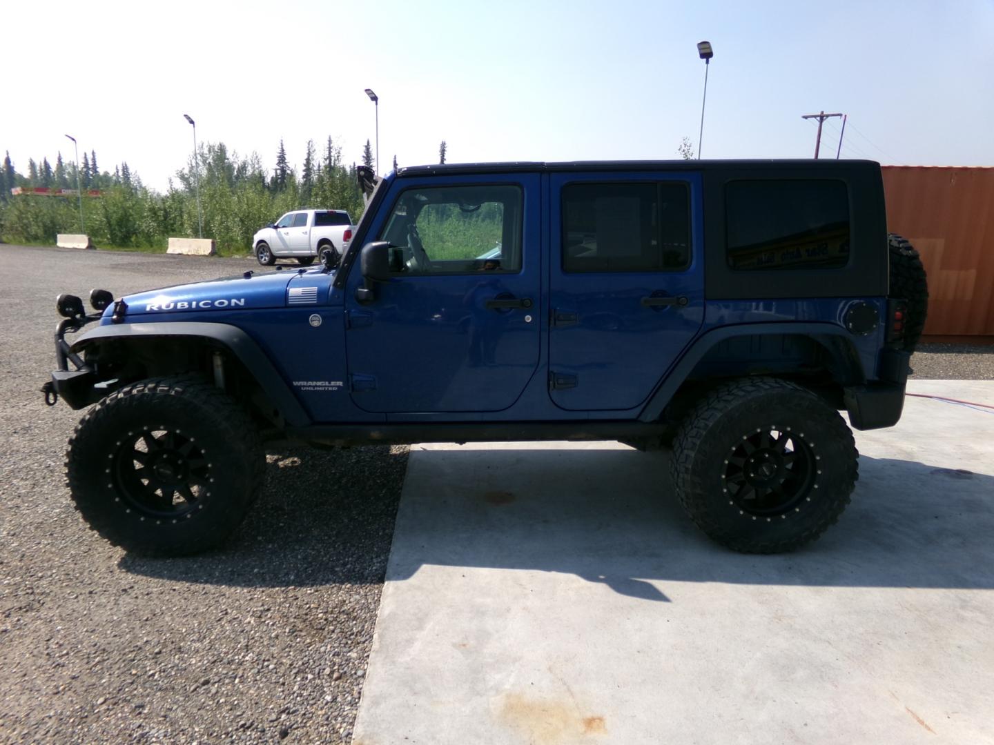 2010 Blue Jeep Wrangler Unlimited Rubicon 4WD (1J4BA6H1XAL) with an 3.8L V6 OHV 12V engine, located at 2630 Philips Field Rd., Fairbanks, AK, 99709, (907) 458-0593, 64.848068, -147.780609 - Photo#2