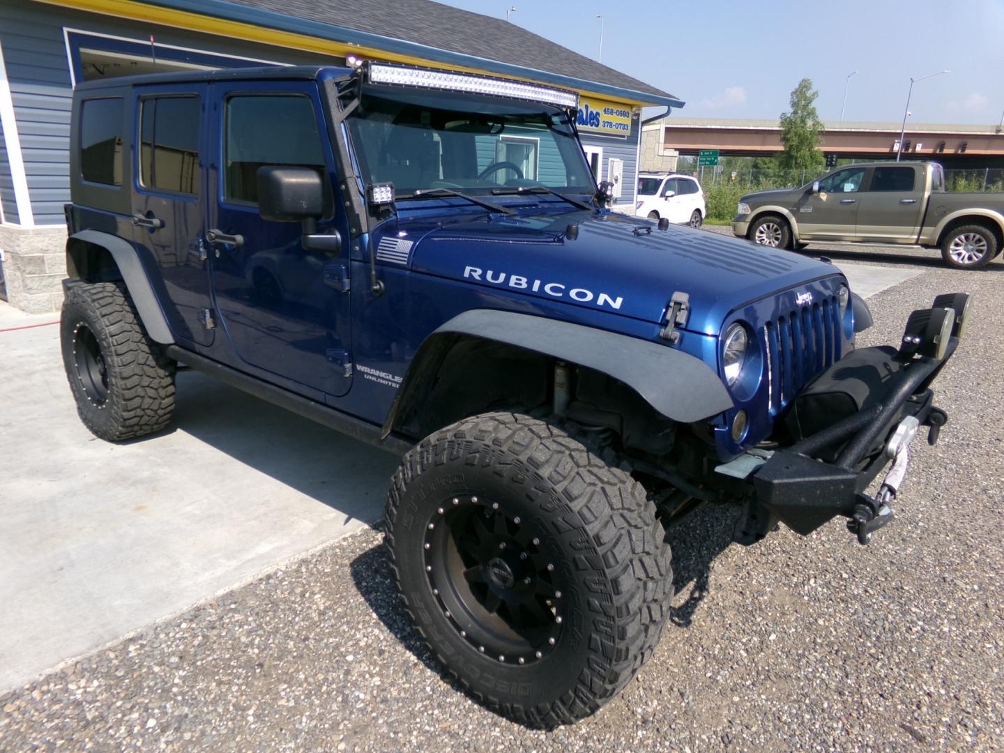 2010 Blue Jeep Wrangler Unlimited Rubicon 4WD (1J4BA6H1XAL) with an 3.8L V6 OHV 12V engine, located at 2630 Philips Field Rd., Fairbanks, AK, 99709, (907) 458-0593, 64.848068, -147.780609 - Photo#0