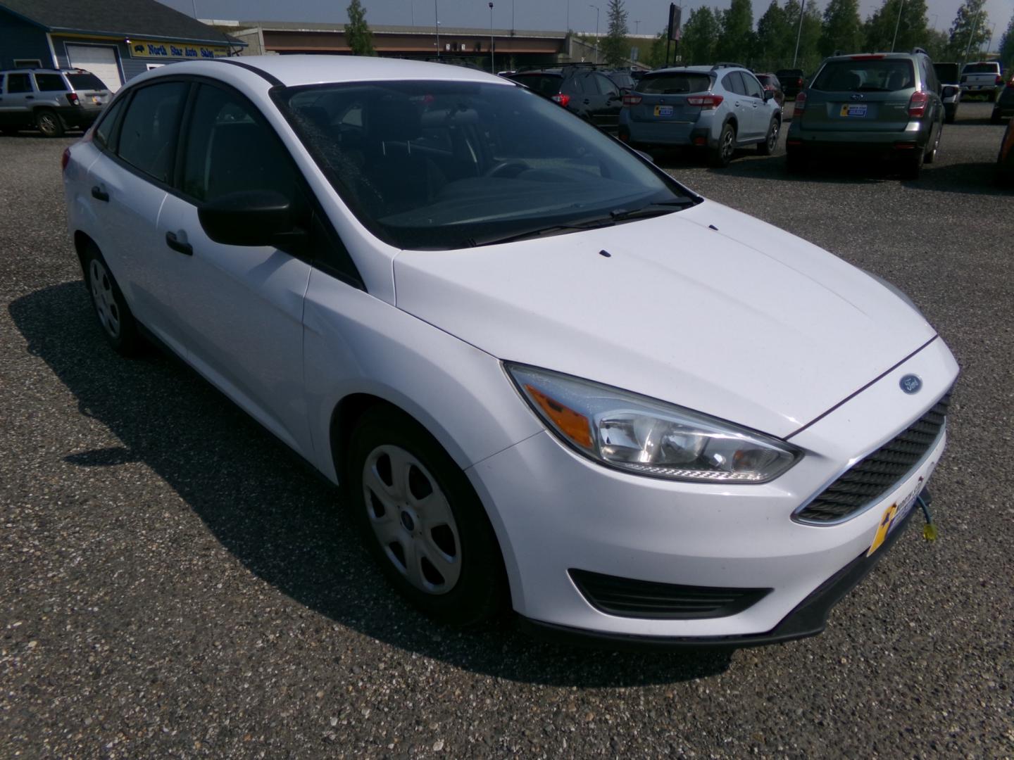 2015 White Ford Focus S Sedan (1FADP3E27FL) with an 2.0L L4 DOHC 16V engine, 5-Speed Automatic transmission, located at 2630 Philips Field Rd., Fairbanks, AK, 99709, (907) 458-0593, 64.848068, -147.780609 - Photo#0