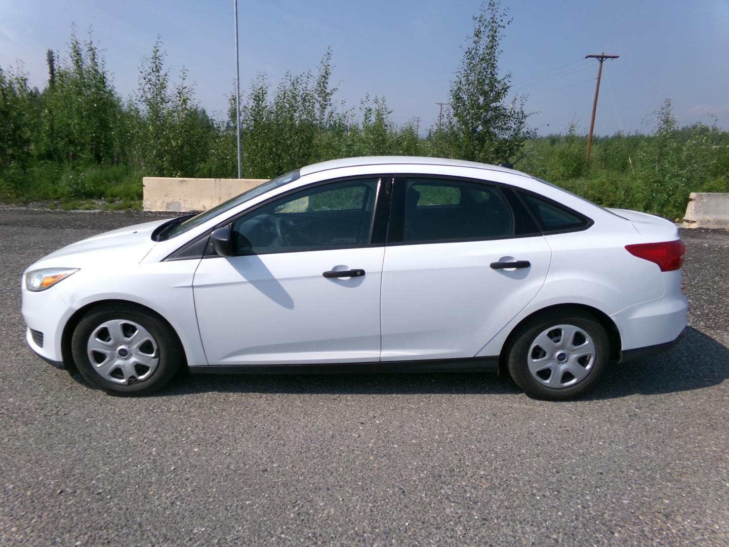 2015 White Ford Focus S Sedan (1FADP3E27FL) with an 2.0L L4 DOHC 16V engine, 5-Speed Automatic transmission, located at 2630 Philips Field Rd., Fairbanks, AK, 99709, (907) 458-0593, 64.848068, -147.780609 - Photo#2