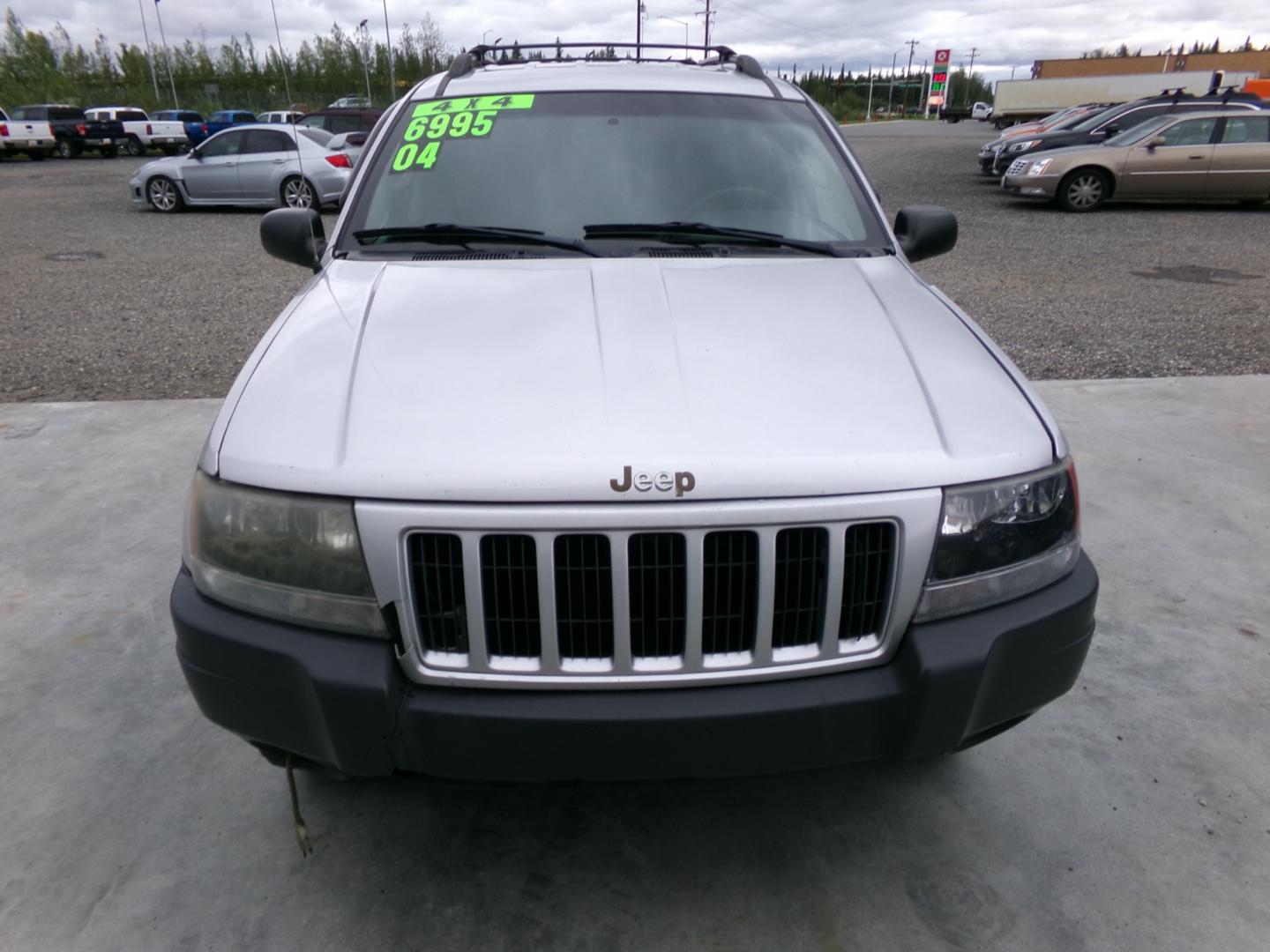 2004 Silver /Black Jeep Grand Cherokee Columbia Edition 4WD (1J4GW48S64C) with an 4.0L L6 OHV 12V engine, 4-Speed Automatic Overdrive transmission, located at 2630 Philips Field Rd., Fairbanks, AK, 99709, (907) 458-0593, 64.848068, -147.780609 - Photo#1