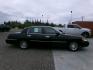 2002 Black Lincoln Town Car Signature (1LNHM82W22Y) with an 4.6L V8 SOHC 16V engine, 4-Speed Automatic Overdrive transmission, located at 2630 Philips Field Rd., Fairbanks, AK, 99709, (907) 458-0593, 64.848068, -147.780609 - Photo#2