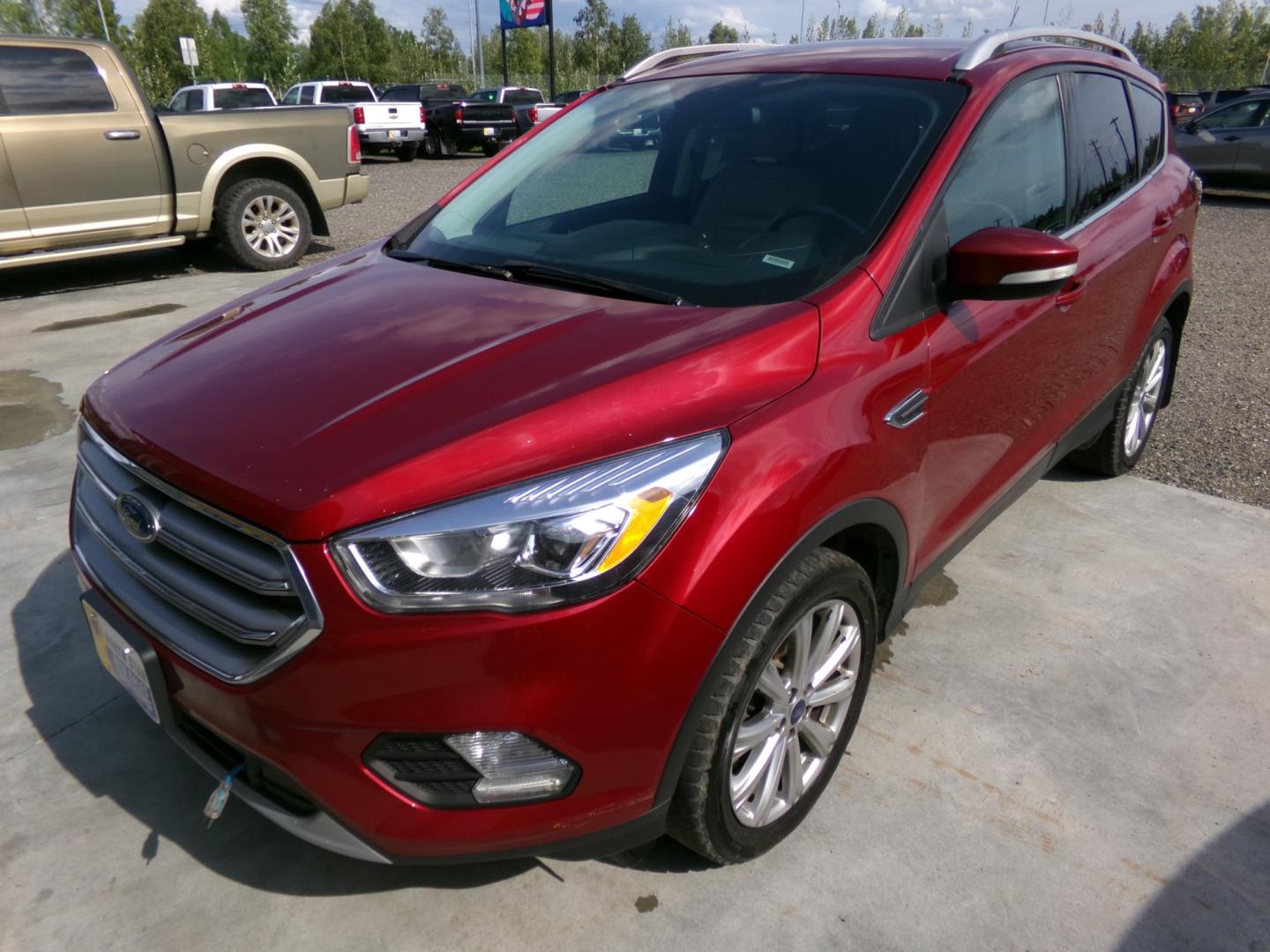 2017 Red Ford Escape Titanium 4WD (1FMCU9J90HU) with an 2.0L L4 DOHC 16V engine, 6A transmission, located at 2630 Philips Field Rd., Fairbanks, AK, 99709, (907) 458-0593, 64.848068, -147.780609 - Photo#0