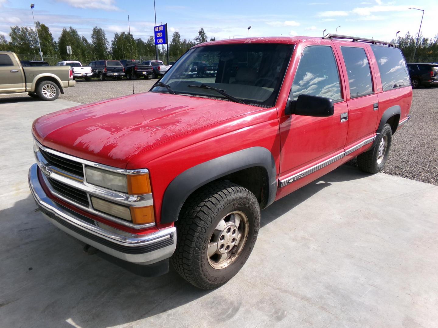 1999 Red Chevrolet Suburban K1500 4WD (1GNFK16R9XJ) with an 5.7L V8 OHV 16V engine, 4-Speed Automatic Overdrive transmission, located at 2630 Philips Field Rd., Fairbanks, AK, 99709, (907) 458-0593, 64.848068, -147.780609 - Photo#0