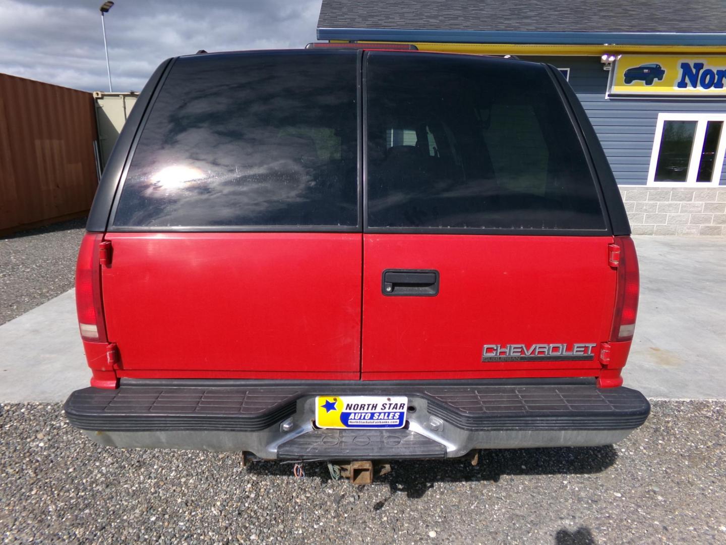 1999 Red Chevrolet Suburban K1500 4WD (1GNFK16R9XJ) with an 5.7L V8 OHV 16V engine, 4-Speed Automatic Overdrive transmission, located at 2630 Philips Field Rd., Fairbanks, AK, 99709, (907) 458-0593, 64.848068, -147.780609 - Photo#1