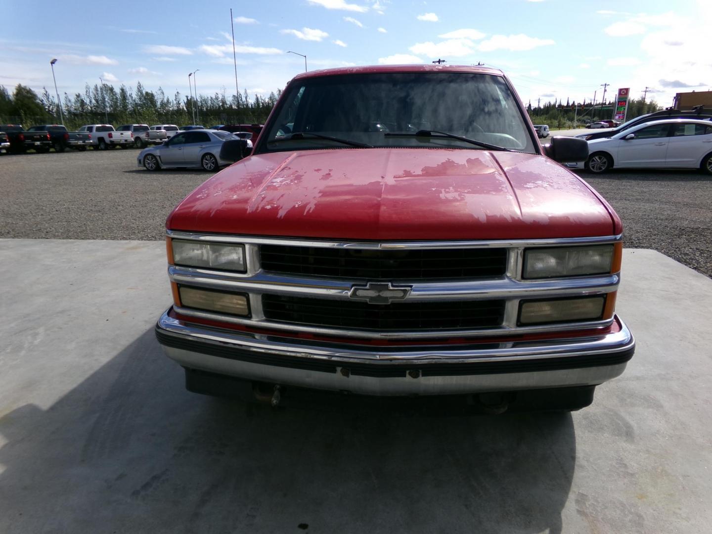 1999 Red Chevrolet Suburban K1500 4WD (1GNFK16R9XJ) with an 5.7L V8 OHV 16V engine, 4-Speed Automatic Overdrive transmission, located at 2630 Philips Field Rd., Fairbanks, AK, 99709, (907) 458-0593, 64.848068, -147.780609 - Photo#2