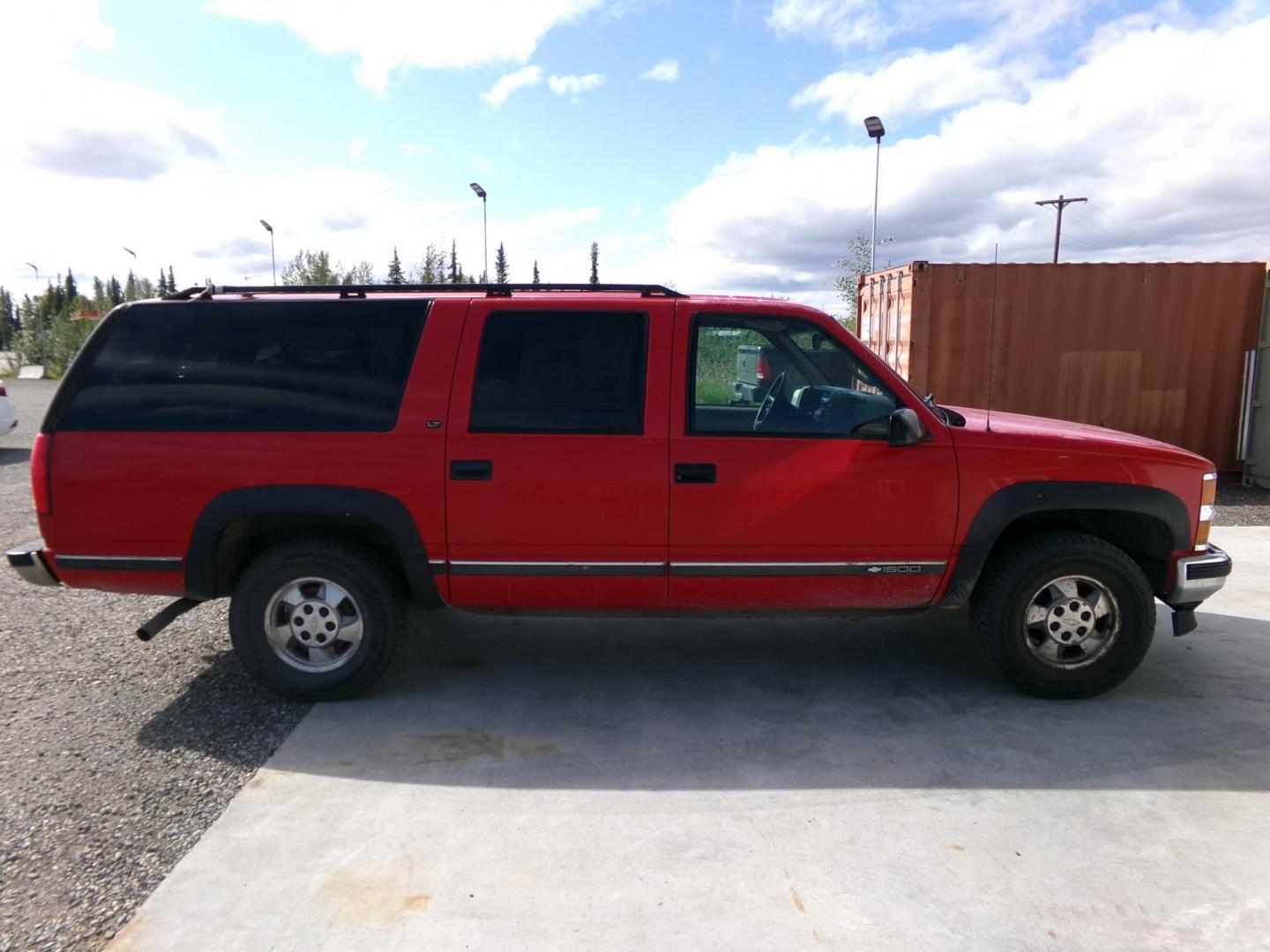 1999 Red Chevrolet Suburban K1500 4WD (1GNFK16R9XJ) with an 5.7L V8 OHV 16V engine, 4-Speed Automatic Overdrive transmission, located at 2630 Philips Field Rd., Fairbanks, AK, 99709, (907) 458-0593, 64.848068, -147.780609 - Photo#3