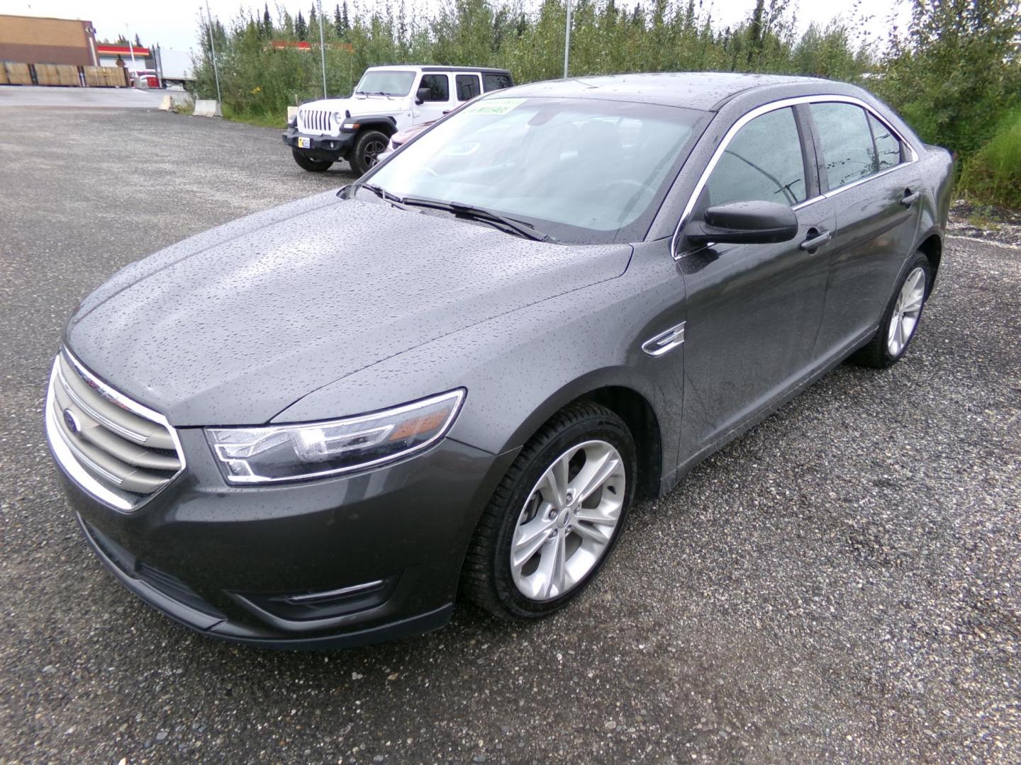 2015 /Grey Ford Taurus SEL AWD (1FAHP2H89FG) with an 3.5L V6 DOHC 24V engine, 6-Speed Automatic transmission, located at 2630 Philips Field Rd., Fairbanks, AK, 99709, (907) 458-0593, 64.848068, -147.780609 - Photo#0