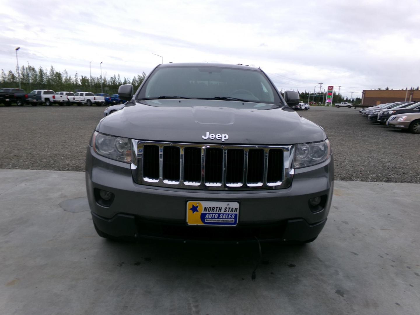 2012 /Black Jeep Grand Cherokee Laredo 4WD (1C4RJFAG8CC) with an 3.6L V6 DOHC 24V engine, 5-Speed Automatic transmission, located at 2630 Philips Field Rd., Fairbanks, AK, 99709, (907) 458-0593, 64.848068, -147.780609 - Photo#1