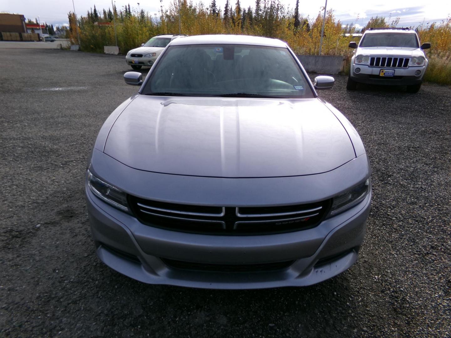 2015 Silver Dodge Charger SE (2C3CDXBG4FH) with an 3.6L V6 DOHC 24V engine, 8-Speed Automatic transmission, located at 2630 Philips Field Rd., Fairbanks, AK, 99709, (907) 458-0593, 64.848068, -147.780609 - Photo#1