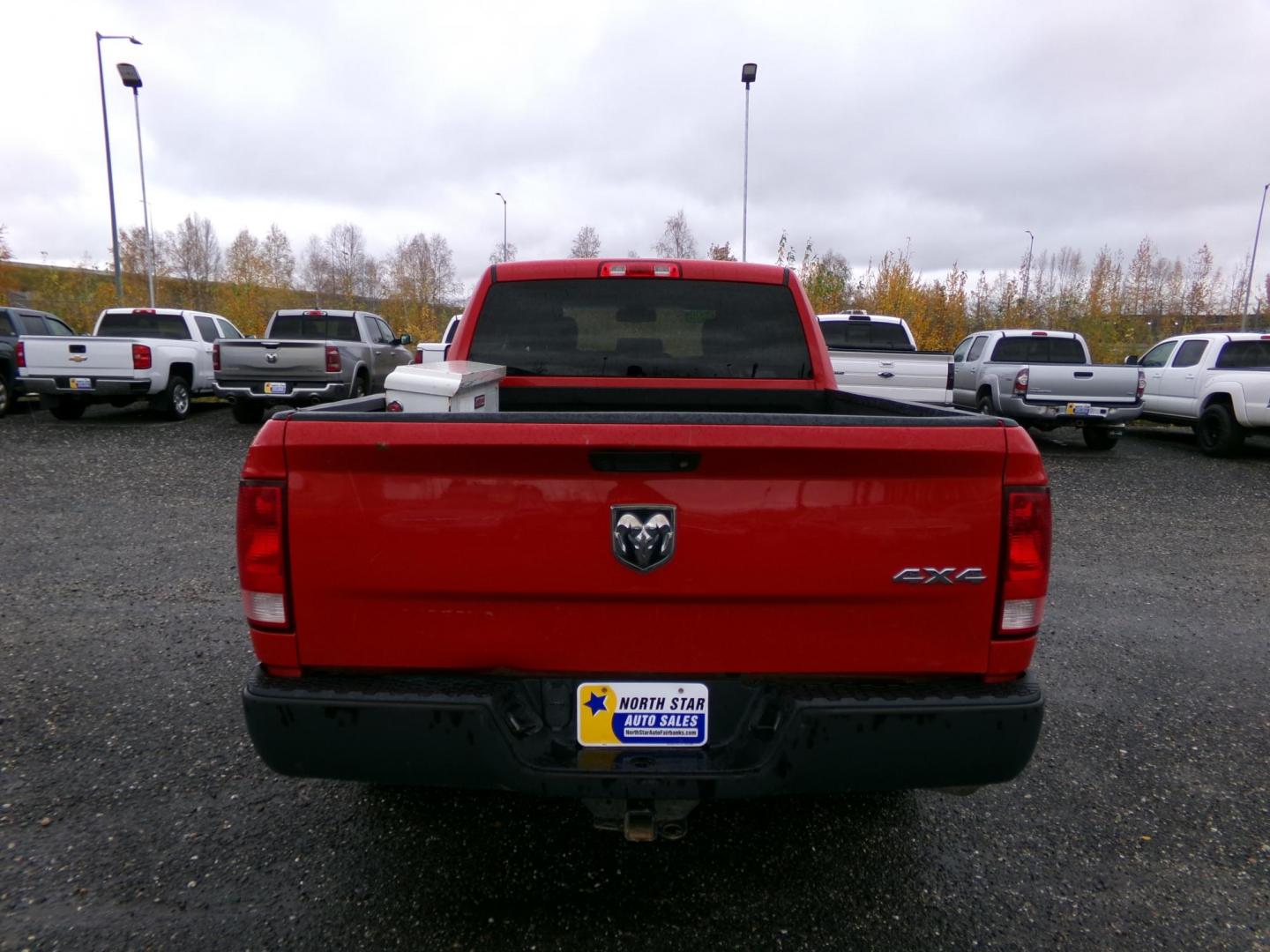 2018 Red Dodge 1500 Tradesman Quad Cab 4WD (1C6RR7FT4JS) with an 5.7L V8 OHV 16V engine, 8A transmission, located at 2630 Philips Field Rd., Fairbanks, AK, 99709, (907) 458-0593, 64.848068, -147.780609 - Photo#1