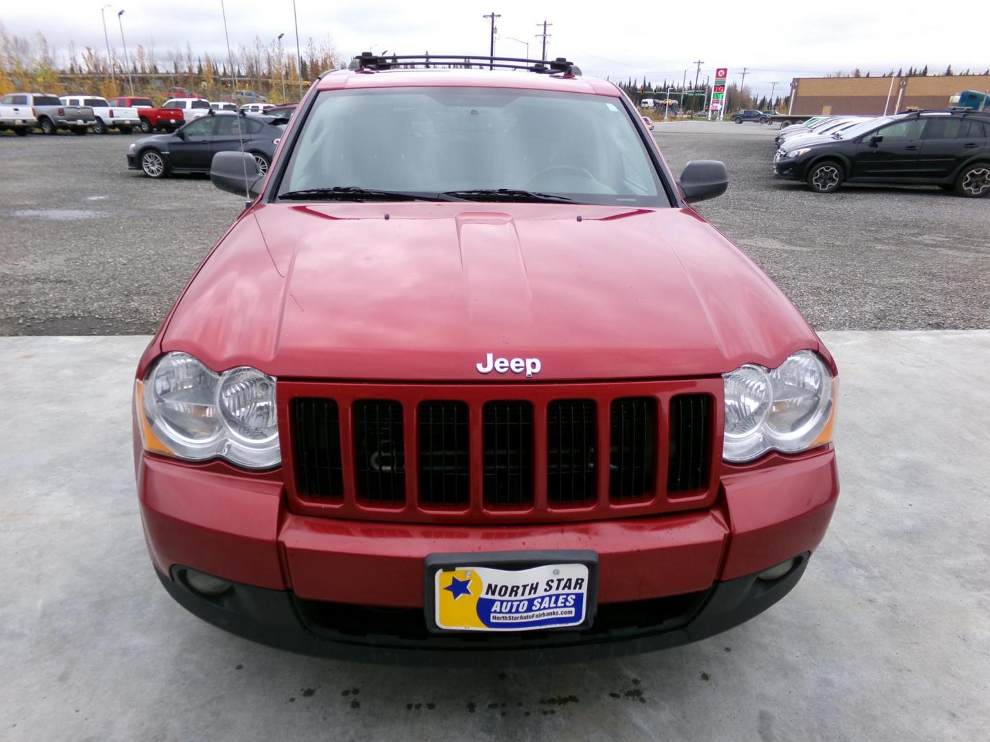 2010 Red Jeep Grand Cherokee Laredo 4WD (1J4PR4GK1AC) with an 3.7L V6 SOHC 12V engine, 5-Speed Automatic transmission, located at 2630 Philips Field Rd., Fairbanks, AK, 99709, (907) 458-0593, 64.848068, -147.780609 - Photo#1