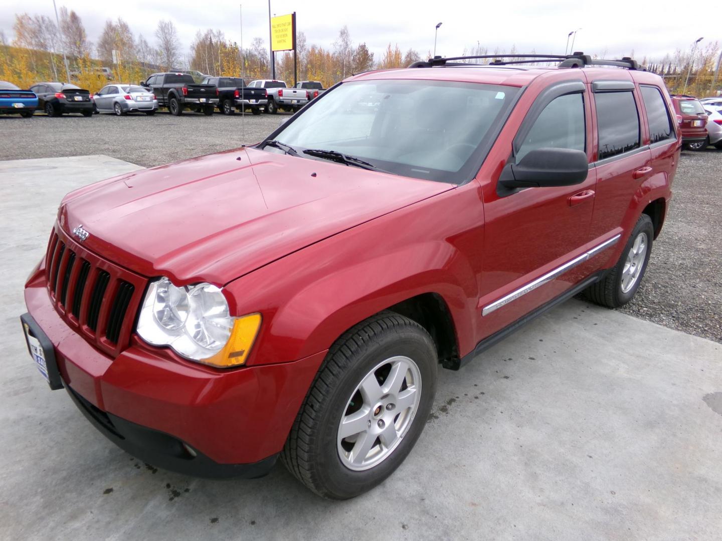 2010 Red Jeep Grand Cherokee Laredo 4WD (1J4PR4GK1AC) with an 3.7L V6 SOHC 12V engine, 5-Speed Automatic transmission, located at 2630 Philips Field Rd., Fairbanks, AK, 99709, (907) 458-0593, 64.848068, -147.780609 - Photo#0