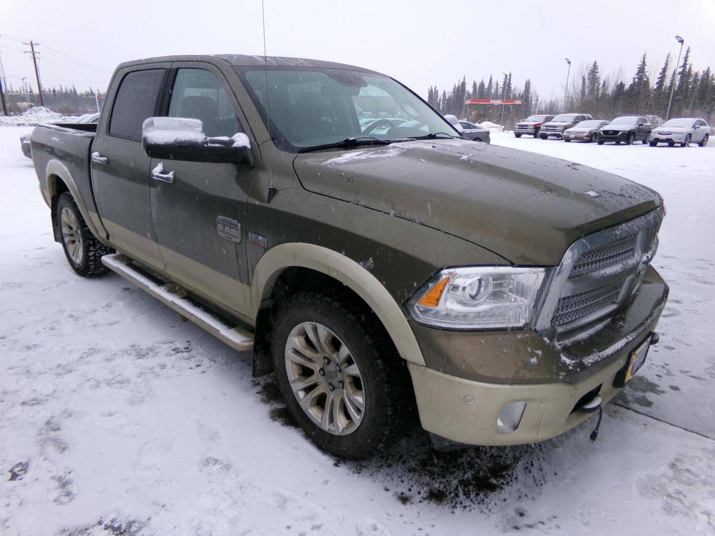 2015 Brown Dodge 1500 Longhorn Crew Cab SWB 4WD (1C6RR7PT9FS) with an 5.7L V8 OHV 16V engine, 6-Speed Automatic transmission, located at 2630 Philips Field Rd., Fairbanks, AK, 99709, (907) 458-0593, 64.848068, -147.780609 - Photo#0