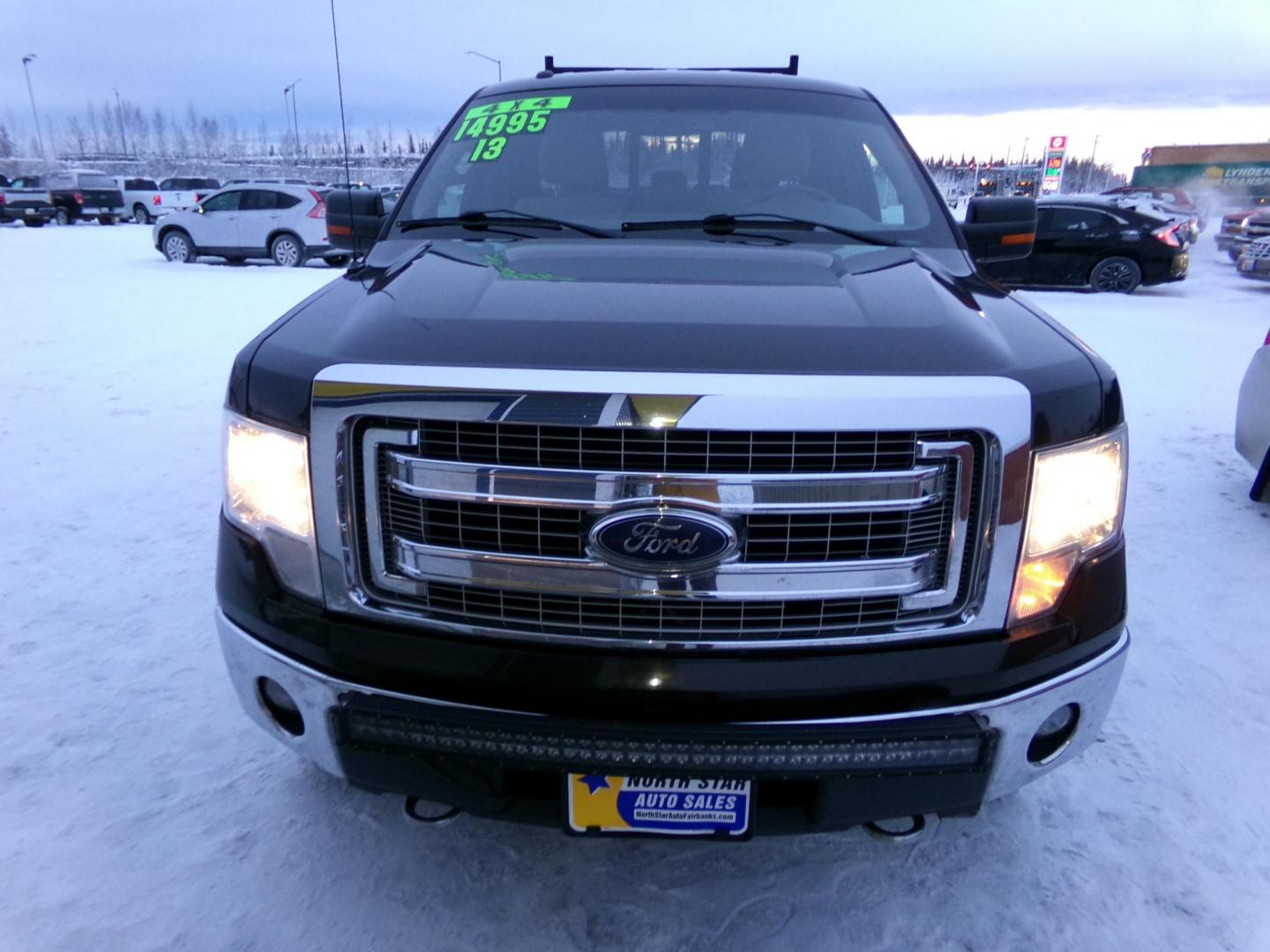 2013 Black /Tan Ford F-150 XLT SuperCrew 6.5-ft. Bed 4WD (1FTFW1EF0DF) with an 5.0L V8 engine, 6-Speed Automatic transmission, located at 2630 Philips Field Rd., Fairbanks, AK, 99709, (907) 458-0593, 64.848068, -147.780609 - Photo#1