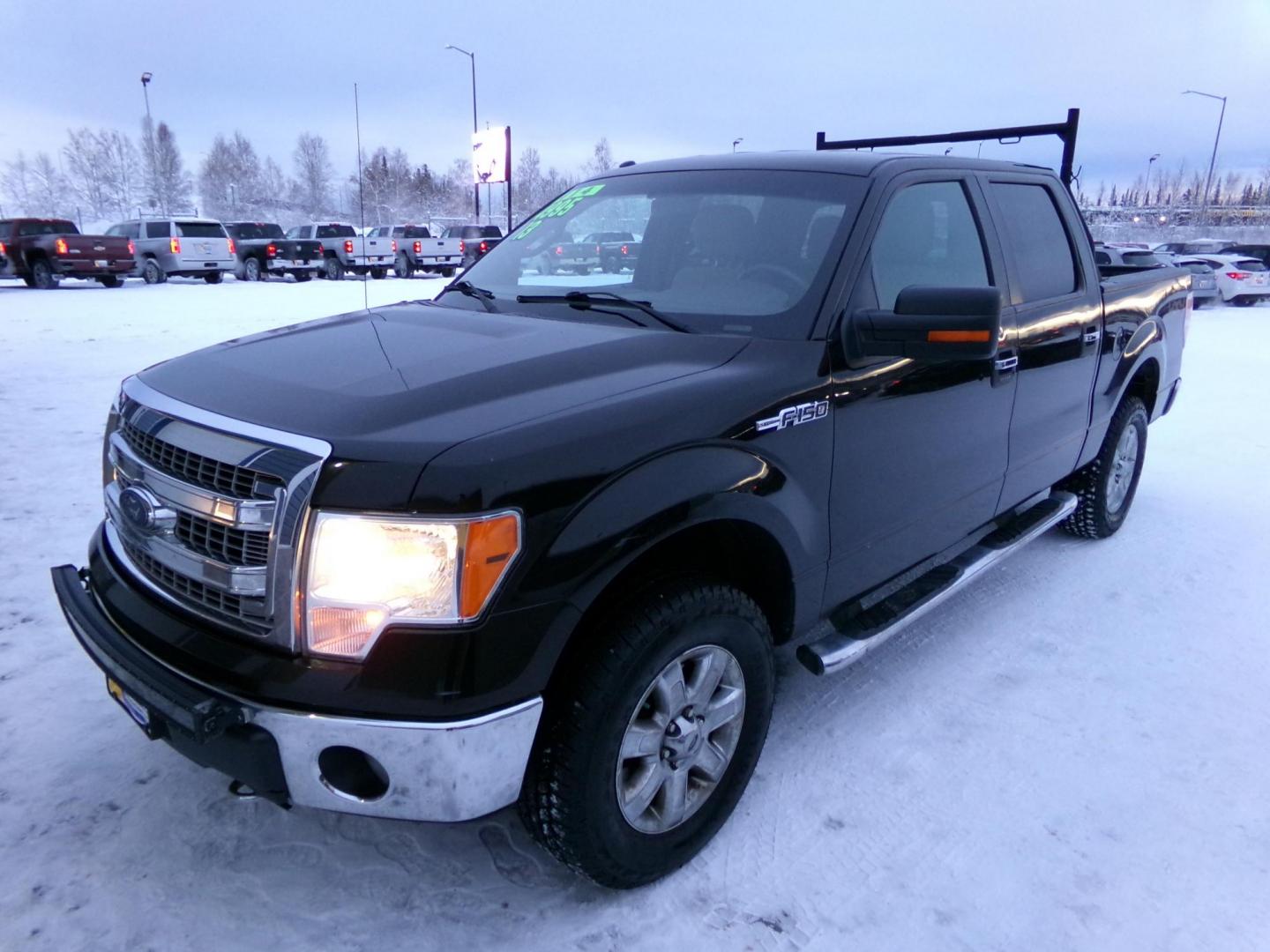 2013 Black /Tan Ford F-150 XLT SuperCrew 6.5-ft. Bed 4WD (1FTFW1EF0DF) with an 5.0L V8 engine, 6-Speed Automatic transmission, located at 2630 Philips Field Rd., Fairbanks, AK, 99709, (907) 458-0593, 64.848068, -147.780609 - Photo#0