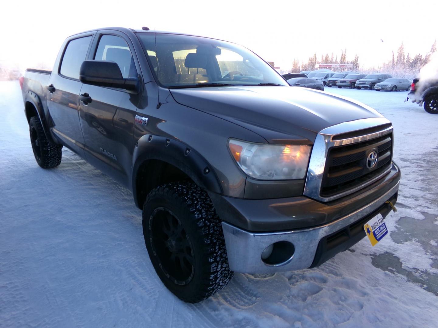 2013 Tan Toyota Tundra Tundra-Grade CrewMax 5.7L FFV 4WD (5TFDW5F18DX) with an 5.7L V8 DOHC 32V FFV engine, 6-Speed Automatic Overdrive transmission, located at 2630 Philips Field Rd., Fairbanks, AK, 99709, (907) 458-0593, 64.848068, -147.780609 - Photo#0