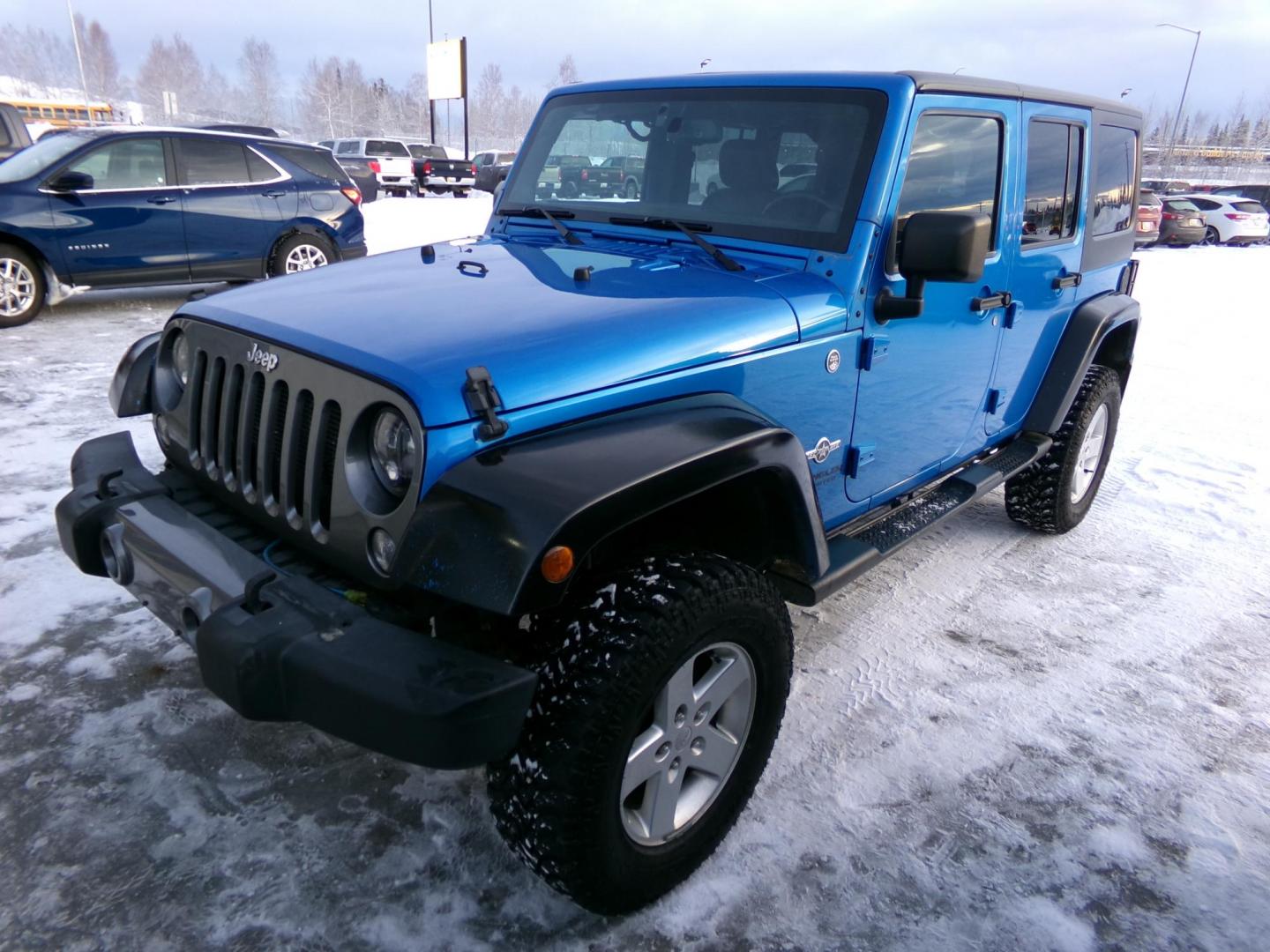 2014 Blue Jeep Wrangler Unlimited Sport 4WD (1C4BJWDG4EL) with an 3.6L V6 DOHC 24V FFV engine, located at 2630 Philips Field Rd., Fairbanks, AK, 99709, (907) 458-0593, 64.848068, -147.780609 - Photo#0